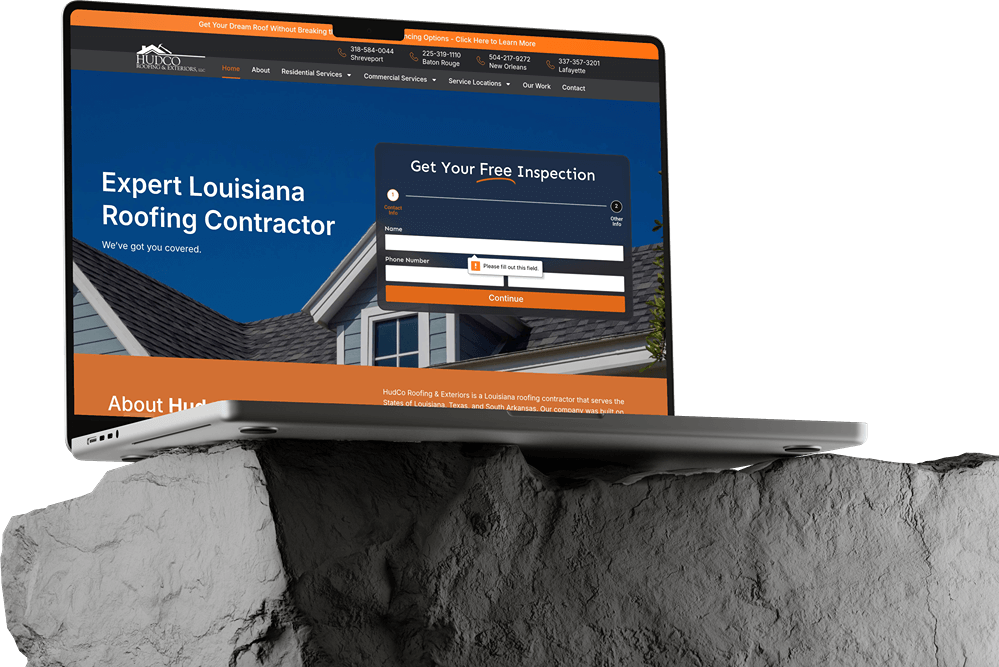 A laptop showcasing a roofing contractor website in dark mode rests on a textured gray rock; the screen highlights a sleek banner, navigation menu, and a pop-up form for free inspection—perfect inspiration for modern website builds.